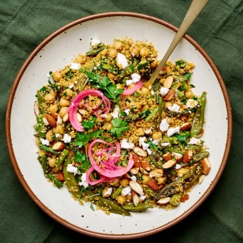 Close up photo of quinoa salad on a large white plate.